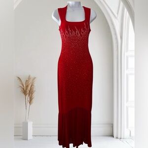 Elegant red dress with sparkling rhinestone’s,  floor length with sheer bottom.